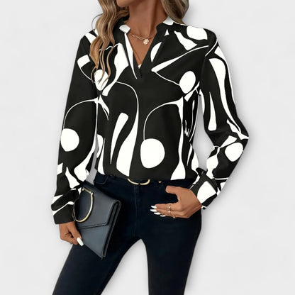 Elegant long-sleeved blouse with pointed neckline
